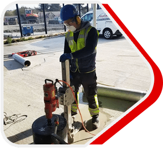 Diamond drilling a precise hole in a concrete wall