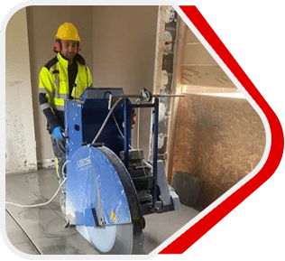 Floor saw cutting a reinforced concrete slab