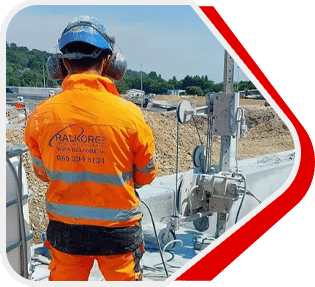 Diamond wire sawing through a concrete structure