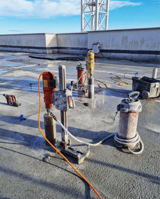Core drilling through reinforced concrete on a construction site