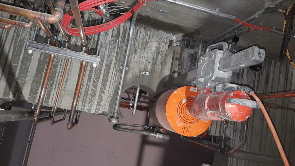 12 inch core barrel drilling horizontally through a concrete wall