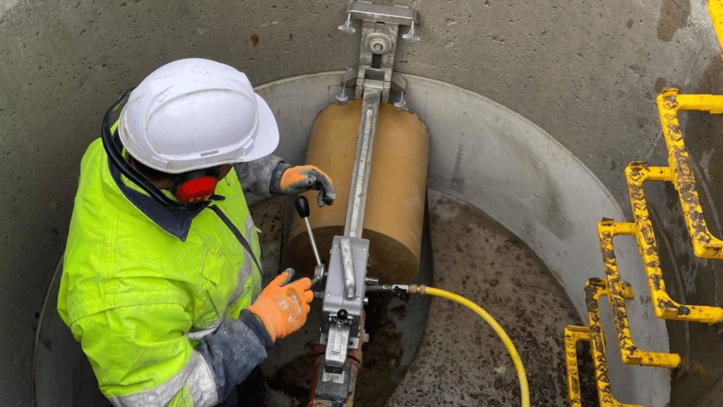 Ralkore operator core drilling inside a concrete chamber