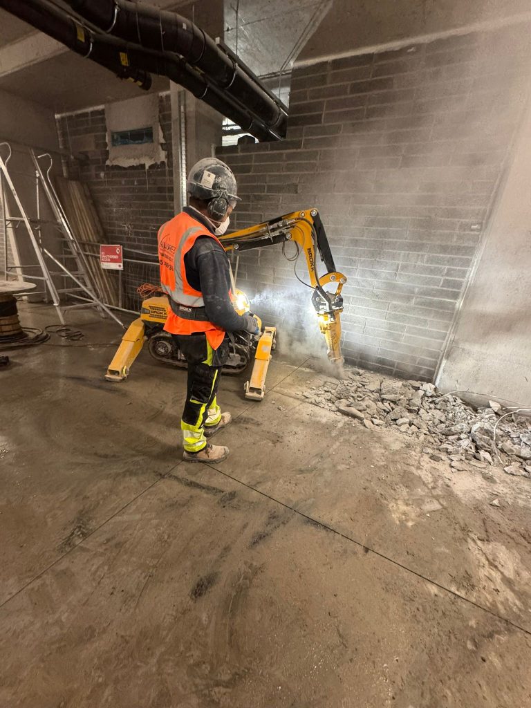 Operator controlling Brokk during internal break-out